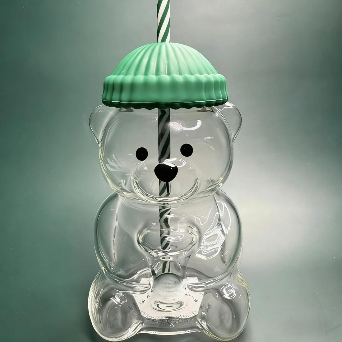 Cute Bear Glass Cup filled with a beverage showing the bear illusion design